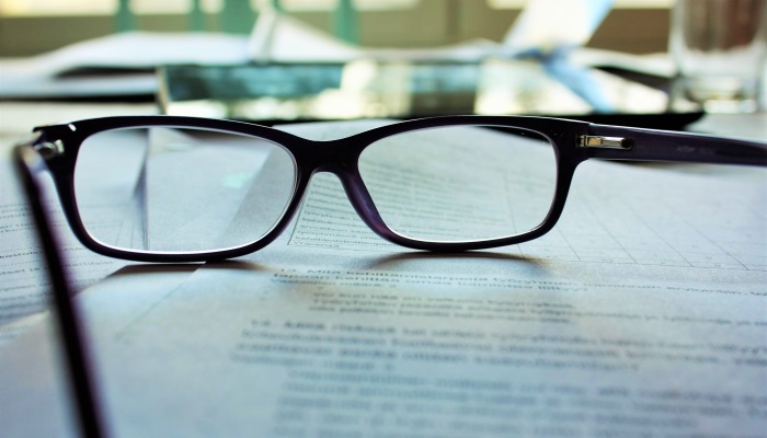 glasses on legal documents